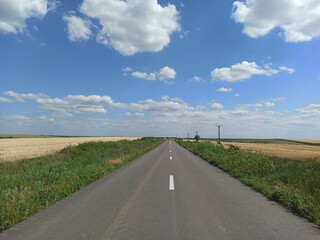 Fototapeta na wymiar Empty countryside road in summer