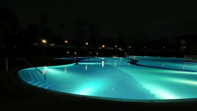 The swimming pool at night.