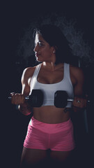 Fototapeta na wymiar Cross training. Young woman exercising at the gym