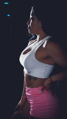 Cross training. Young woman exercising at the gym