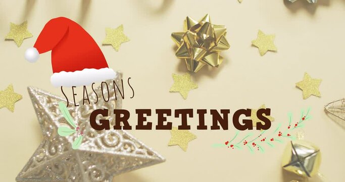 Animation of seasons greetings text over christmas decorations