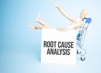 Wooden Doll in a shopping with white paper and Root Cause Analysis sign. Business concept
