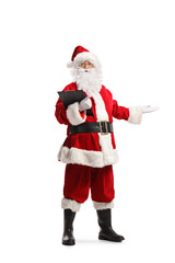 Full length portrait of Santa Claus holding a clipboard and welcoming with hand