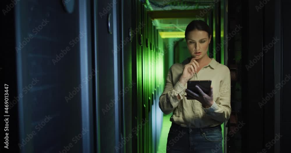 Poster caucasian female it technician using tablet checking computer server