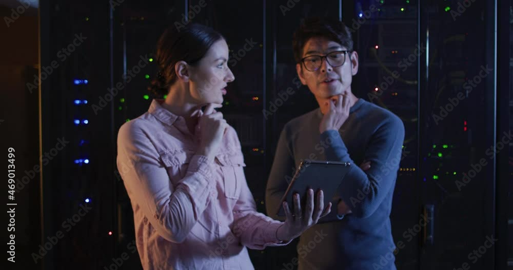 Poster diverse female and male it technicians using tablet checking computer server