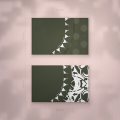 Presentable dark green business card with Greek white ornaments for your brand.