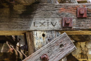 Roman numerals carved in timber