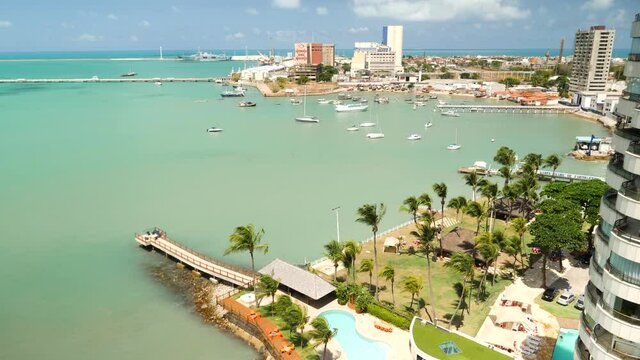 Aerial footage of Fortaleza famous beach in Brazil. Buildings and hotels landscape on the shore. Skyline of Fortaleza city.