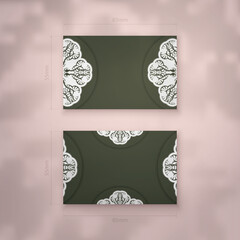 Visiting business card in dark green color with vintage white ornaments for your business.
