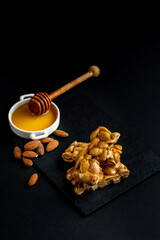 Traditional Christmas dessert in Spain, Portugal, and Italy made of honey, sugar and toasted almonds