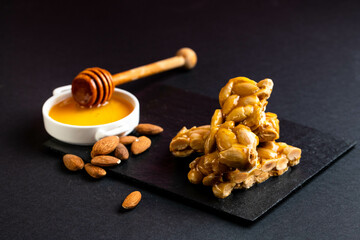 Traditional Christmas dessert in Spain, Portugal, and Italy made of honey, sugar and toasted almonds