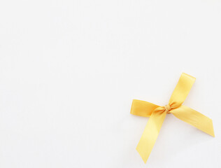 ribbon bow on white paper background