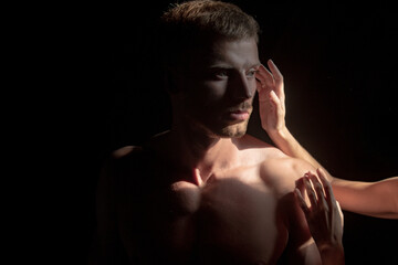 Closeup face of a beautiful young lovers man in love embracing, romance and and affection.