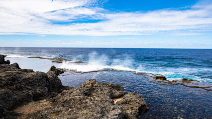 A beautiful view of the spectacular coastal blowholes that are an important tourist attraction on the Pacific Island nation of Tonga, on a beautiful sunny day.