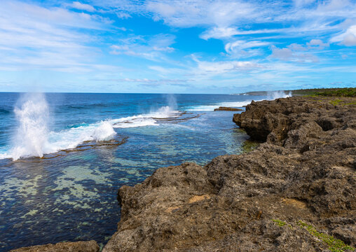 A view of the spectacular coastal blowholes that are an important tourist attraction on the Pacific Island nation of Tonga, on a beautiful sunny day.
