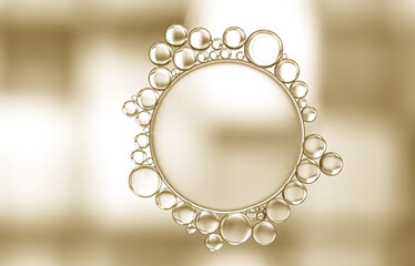 A unique pattern developed when oil droplets were added to a beaker of water to produce one large and numerous smaller bubbles surrounding the large one. Gold and white lighting enhanced the effect.