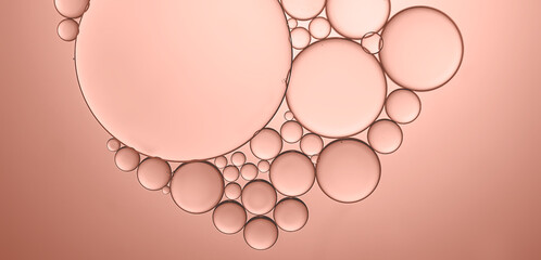 Oil and water bubbles on rose pink background. Art image pattern.