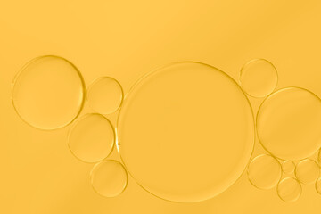 Bright golden-yellow of oil and water bubbles background.