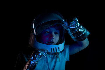 Child boy playing astronaut with spaceman. Close up excited kids face.