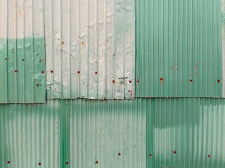 A rusty green corrugated iron metal texture background. Old rusty zinc plat wall ,rusty Zinc grunge background. vintage style