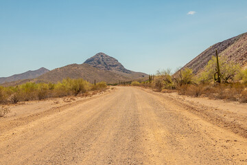Dusty road leading to a mountain in Arizona