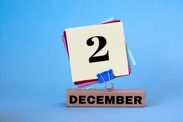 December 2nd. Day 2 of month, Top view calendar on informal workplace background . Winter time