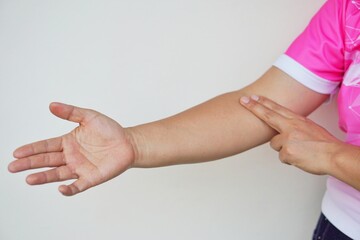 Close up woman hand is checking pulse on arm  Concept, Medical health care. Self checking heart rate pulse 