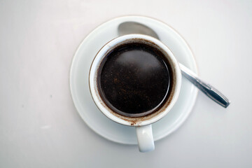  cup of black coffee on a white table
