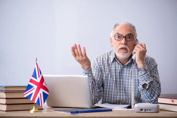 Old english language teacher in the classroom