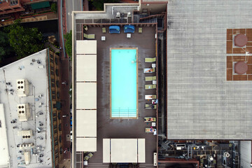 Aerial view of urban rooftop pool and loungers in San Antonio