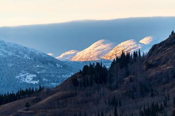 Stunning morning sunrise shot in northern Canada, with boreal forest wilderness in view with...