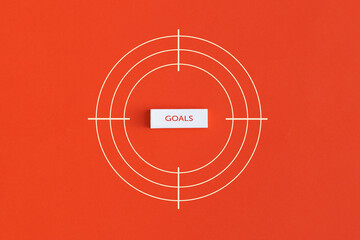 Goal word in the center of the target on red background.