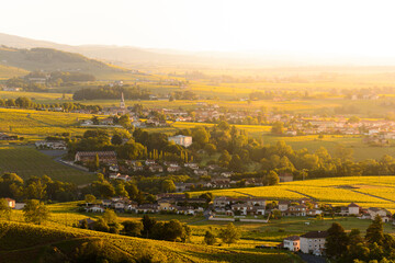 Fototapeta na wymiar Landscape and village of Beaujolais land at sunrise