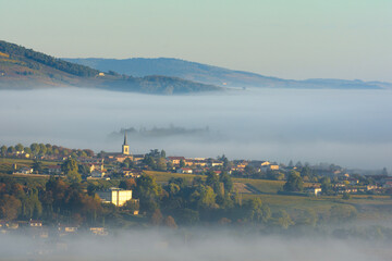Village of Saint Etienne des Oullieres in Beaujolais land during sunrise