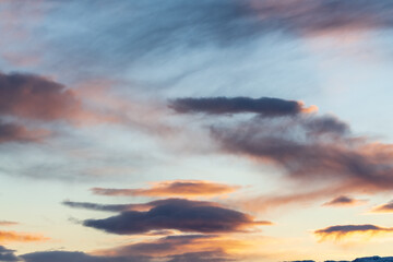 Dark clouds with hints of pink, purple and orange tones great for editing or sky replacement filters photography resources. 