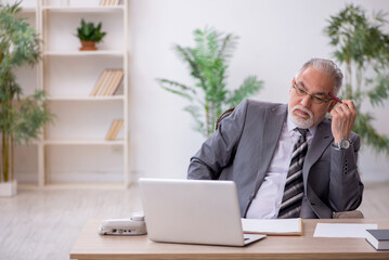 Old male employee and too much work in the office