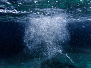 Air bubbles in the water background.Abstract oxygen bubbles in sea.Water bubbles isolate on black...