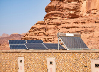 Photovoltaic solar panels on top of a building in Wadi Rum desert, Jordan