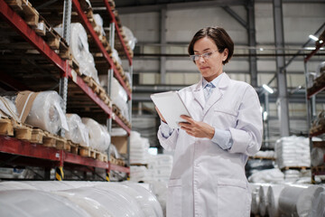 Female worker using tablet at the factory