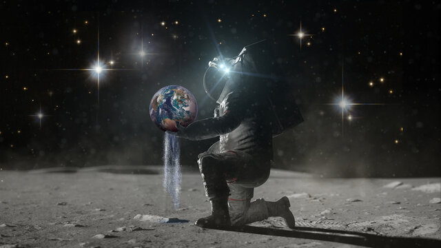 Astronaut sits on his knee on lunar surface holds planer Earth in hands and pours earth's water through his fingers. Water day concept. Water as a treasure. Elements of this image furnished by NASA.