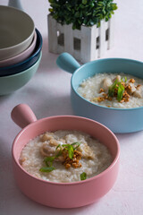 ox tripe congee or also known as goto in colorful bowls