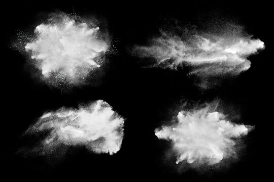 Set of dust powder clouds on black background