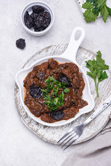 Hot stewed meat with prunes