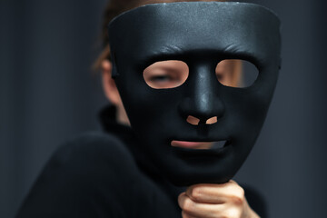 espionage mask, confidentiality of personal information on the web, anonymous search and use of the Internet,woman with black mask