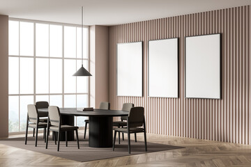 Corner view on bright gallery room interior with three posters