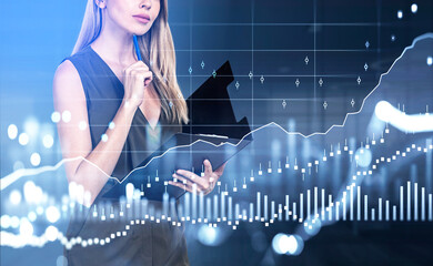 Businesswoman with clipboard, candlesticks and lines hologram