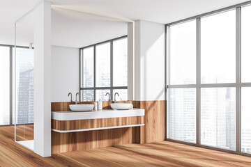 Corner view on bright bathroom interior with two sinks