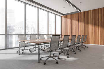 Conference room interior with furniture and panoramic windows with city view