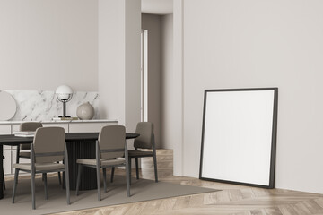 Standing canvases in light beige dining room. Corner view.