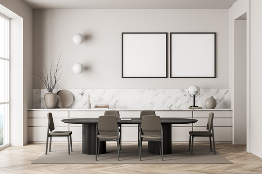 Two square canvases in light beige dining room
